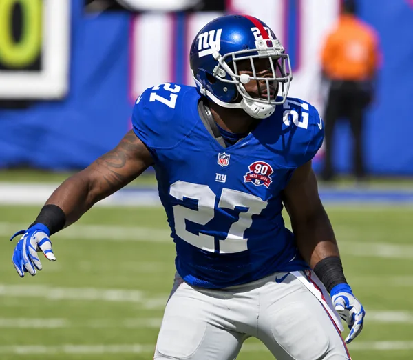 Stevie Brown on the football field in a New York Giants blue number 27 uniform